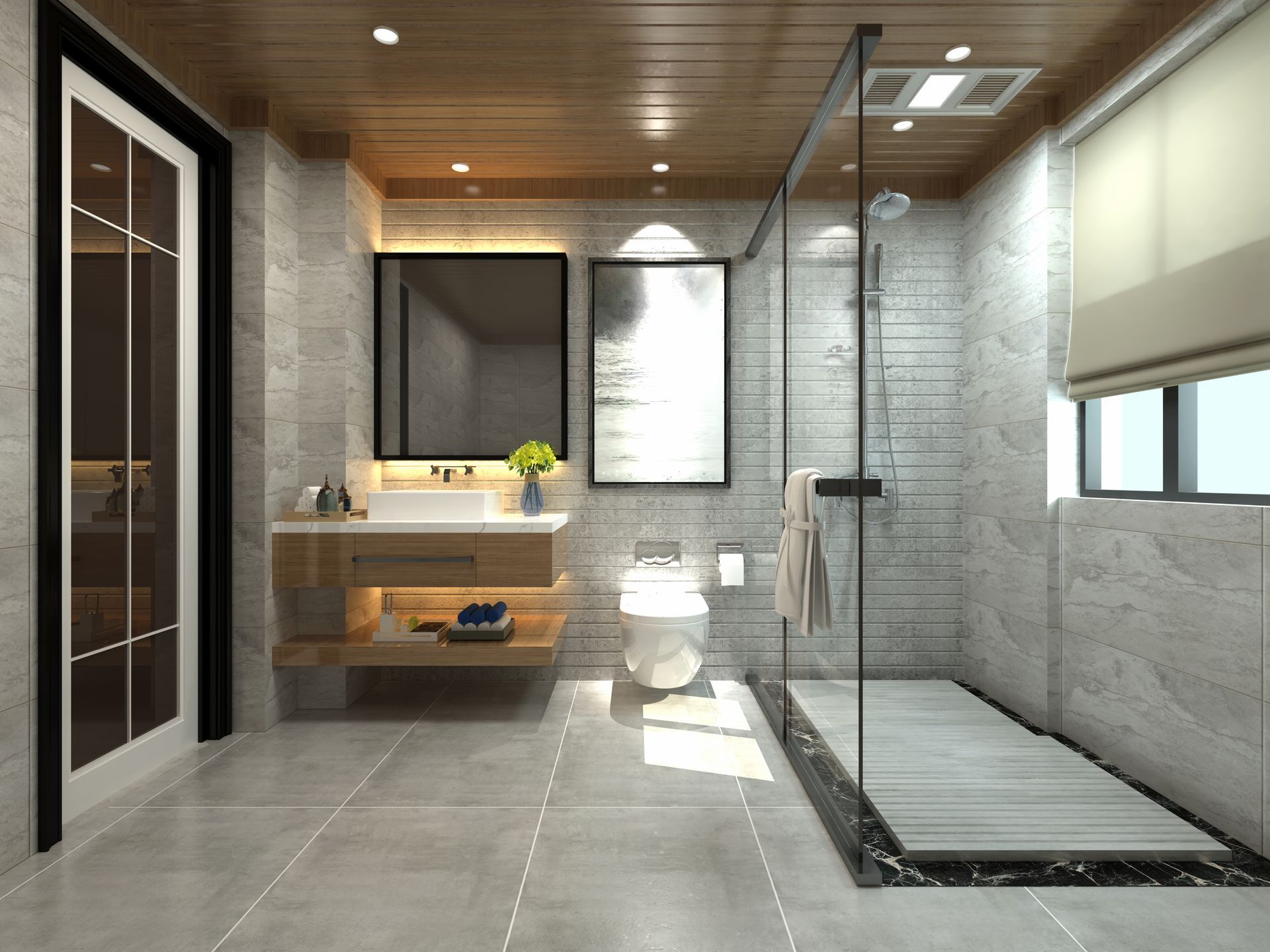Modern bathroom with shower, toilet, and vanity. Gray tile and wooden accents create a clean, minimalist design.