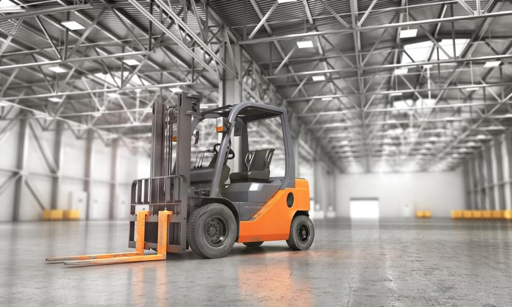 Forklift is Parked in an Empty Warehouse — Bundaberg Forklift Repairs Bundaberg North, QLD