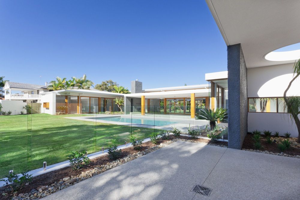 A Modern Backyard With Large Swimming Pool — Mid Coast Glass Fencing In Taree, NSW