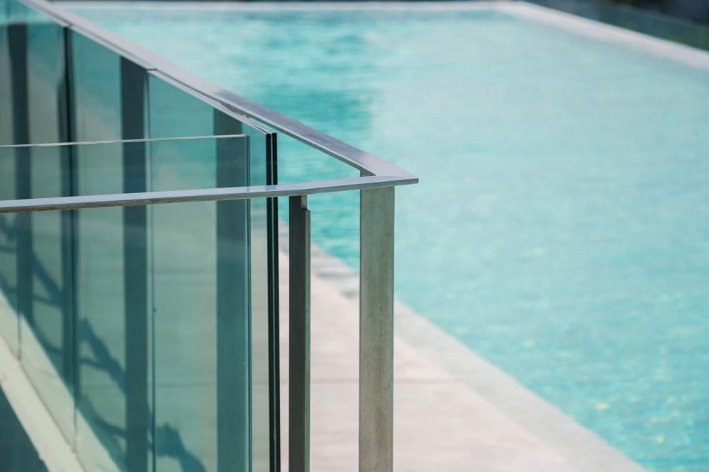 Modern Stainless Railing And Glass Wall On Outdoor Poolside — Pool Fencing In South West Rocks, NSW