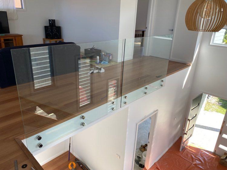 An Aerial View Of A Living Room With A Glass Railing — Mid Coast Glass Fencing In Old Bar, NSW