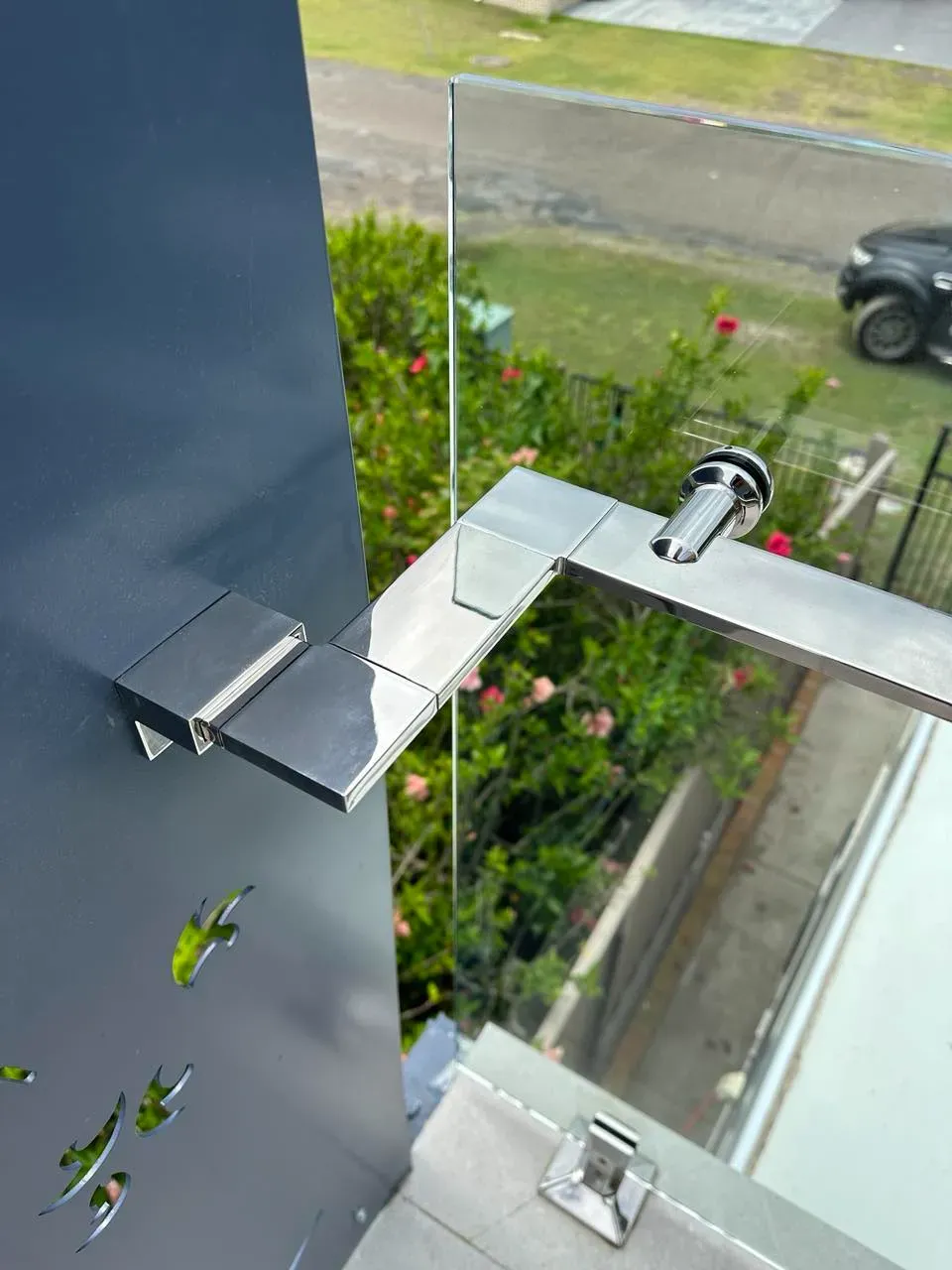 A Close Up Of A Stainless Steel Railing On A BalcONY — Mid Coast Glass Fencing In Bonny Hills, NSW