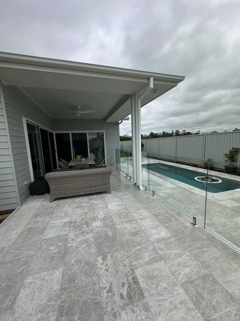 There Is A Swimming Pool In The Backyard Of A HoUSE — Mid Coast Glass Fencing In Forster, NSW