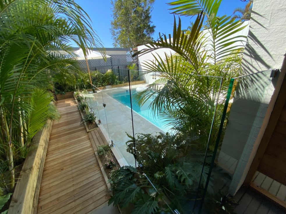 Modern Swimming Pool With Glass Fence — Mid Coast Glass Fencing In Old Bar, NSW