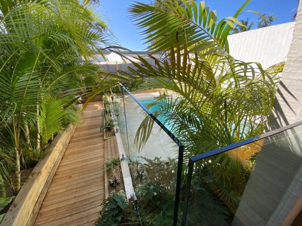 Modern Garden With Frameless Glass Pool Fencing — Mid Coast Glass Fencing In Old Bar, NSW
