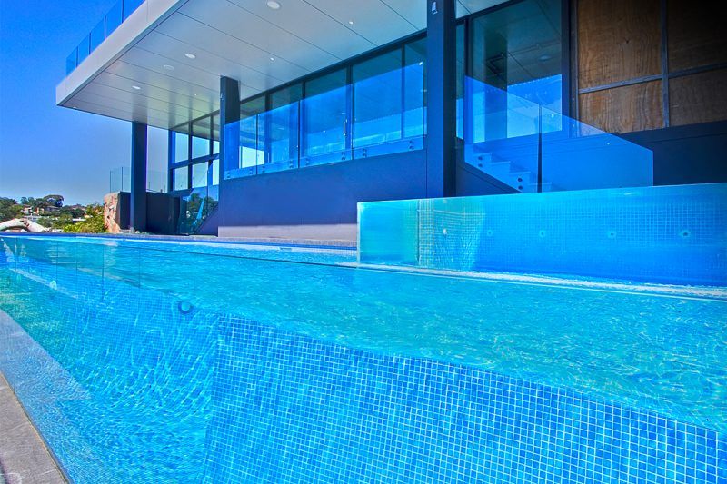 Clear Glass Of Fence In Modern Swimming Pool — Mid Coast Glass Fencing In Old Bar, NSW