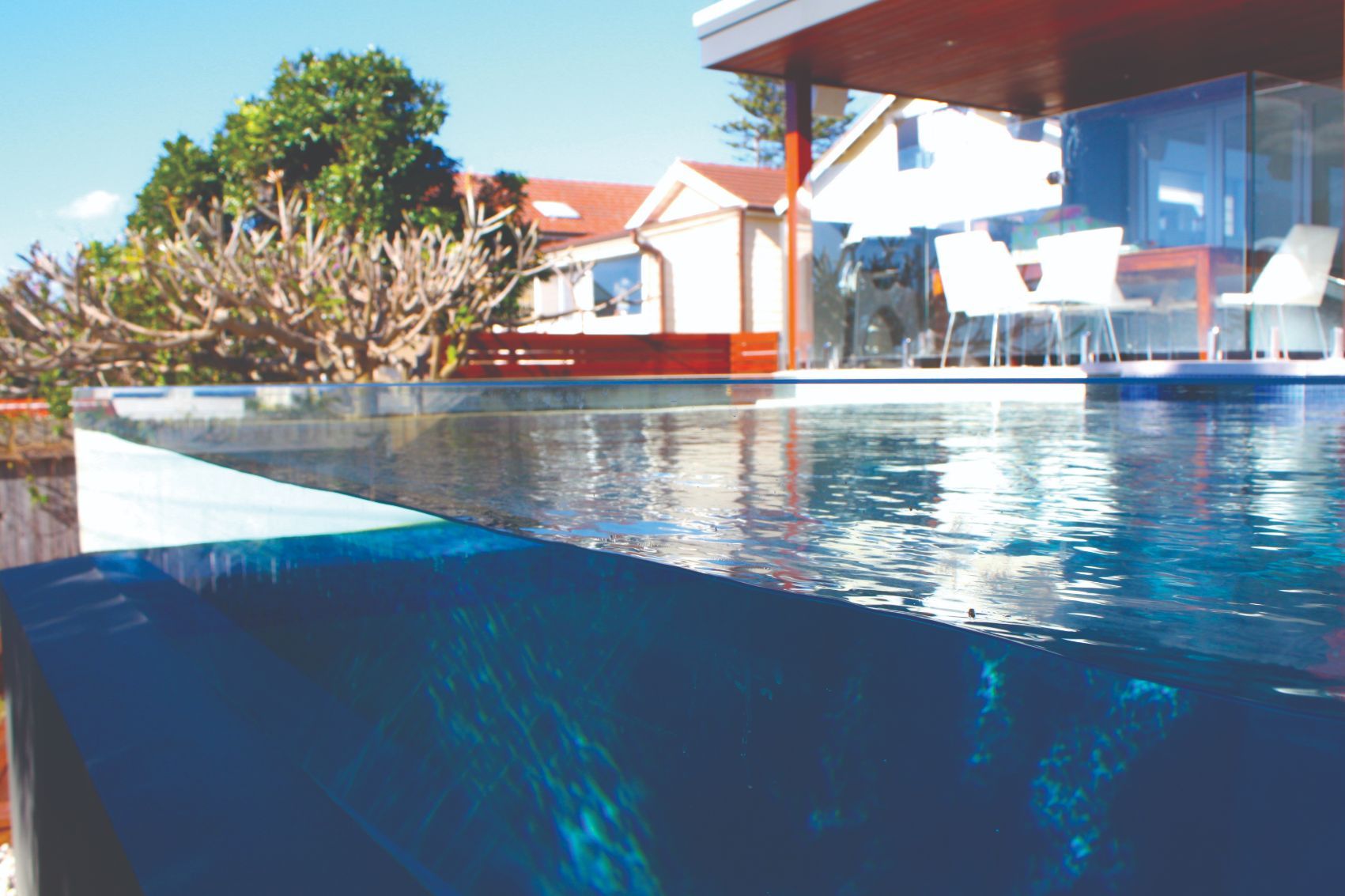 Zoom In Photo Of A Clear Glass Fence From Swimming Pool — Mid Coast Glass Fencing In Old Bar, NSW