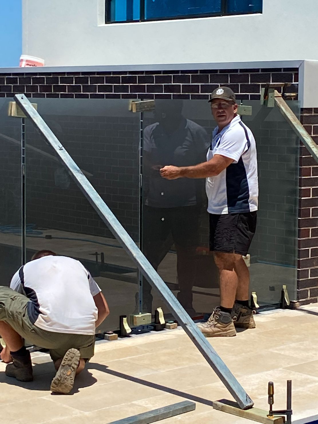 Two Man Working With The Fence — Mid Coast Glass Fencing In Old Bar, NSW
