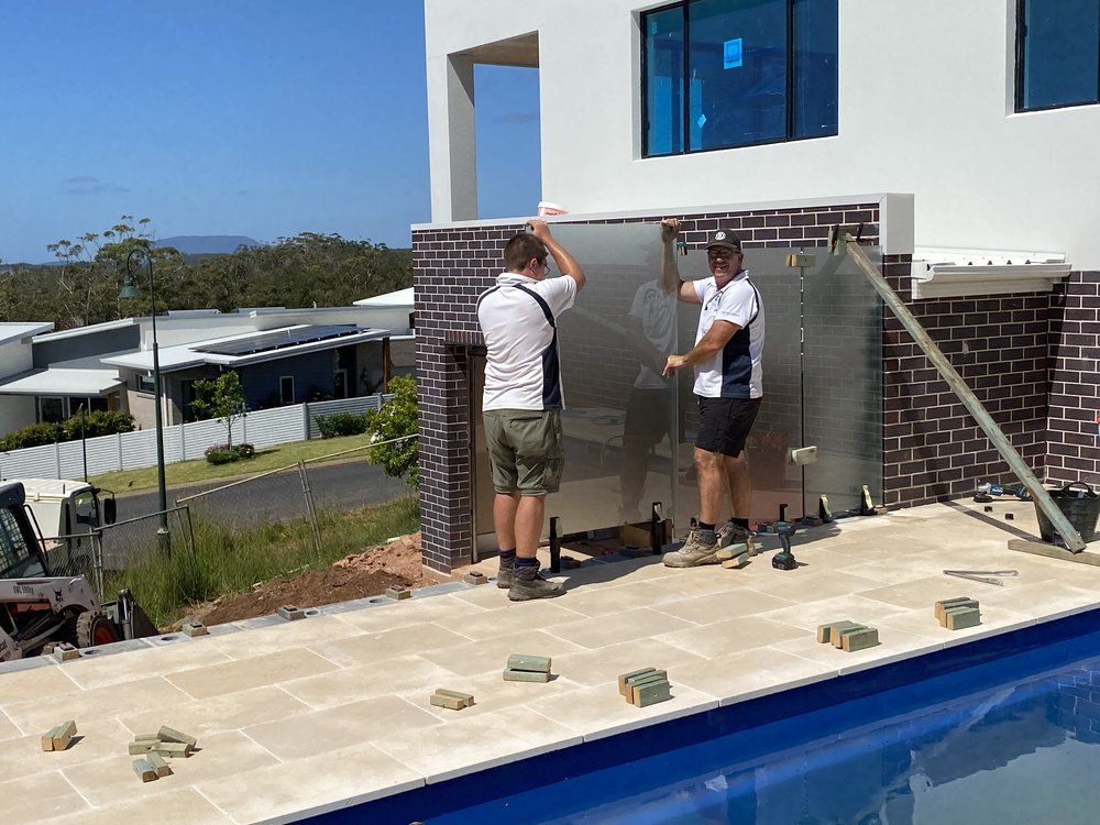 Two Worker Installing Matelux Glass — Mid Coast Glass Fencing In Old Bar, NSW