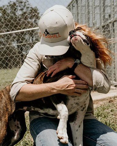 Girl Hugging Dog 2 — Furhill Pet Boarding in East Kempsey, NSW