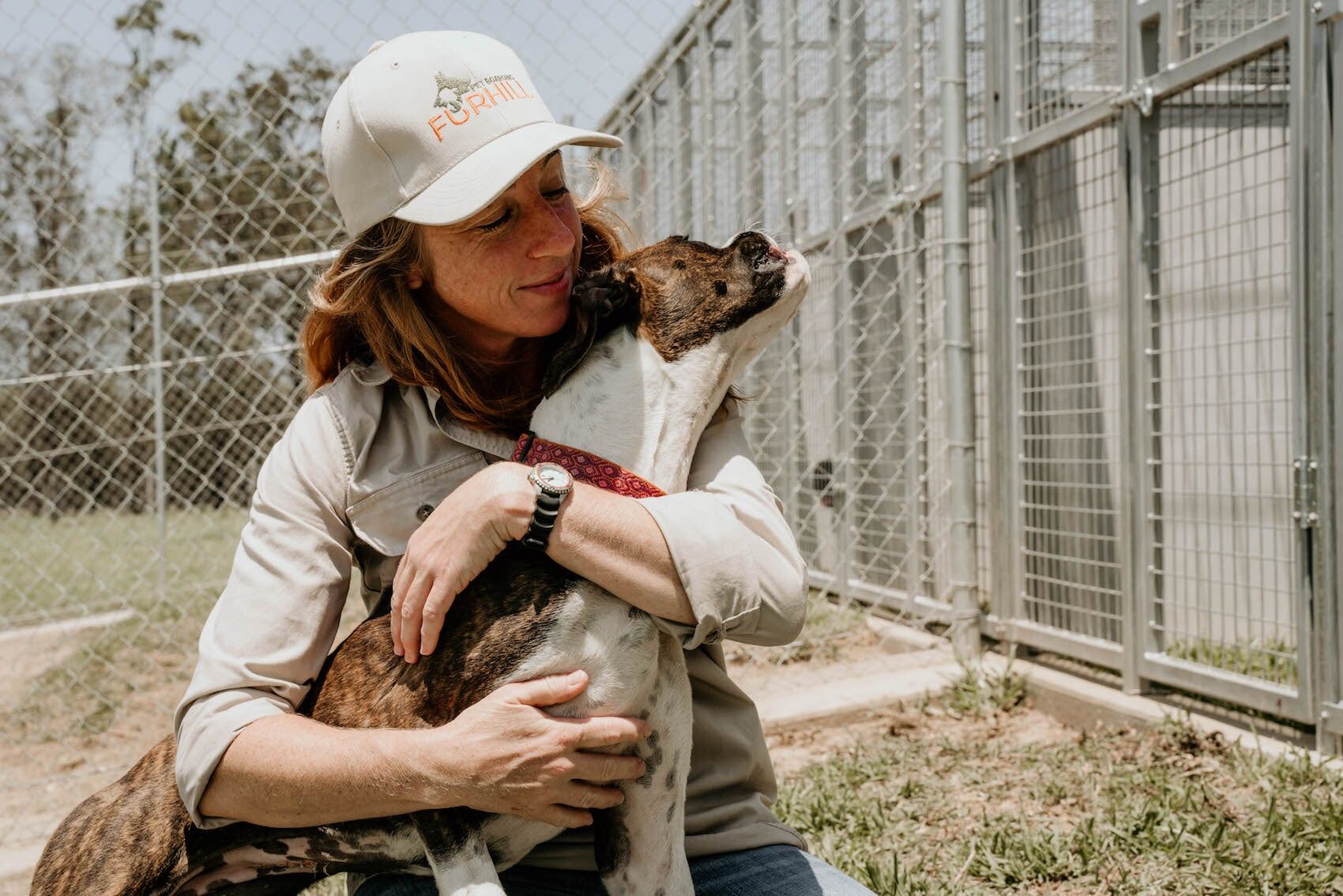 Girl Hugging Dog — Furhill Pet Boarding in East Kempsey, NSW