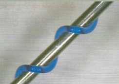 A close up of a metal pipe with blue clips attached to it.