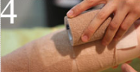 A person is wrapping their arm with a roll of paper