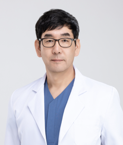A doctor wearing glasses and a white coat