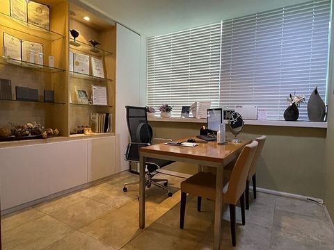 There is a table and chairs in the room.