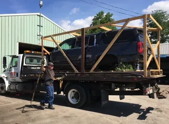 Man Checking the Old Car — Cleves, OH — Miamitown Auto Parts & Recycling