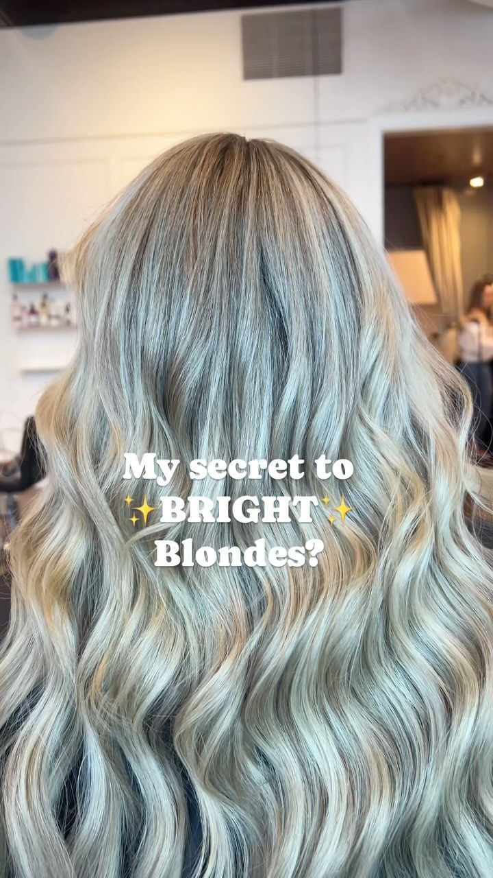 a woman with blonde hair is sitting in a chair in a salon .