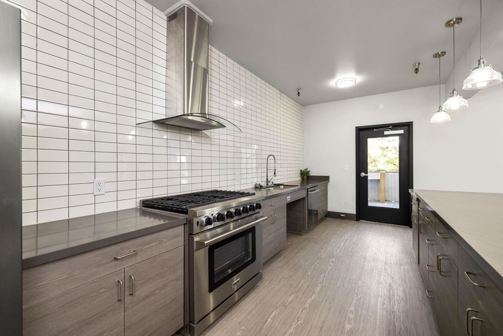 Photo of a kitchen on a long wall