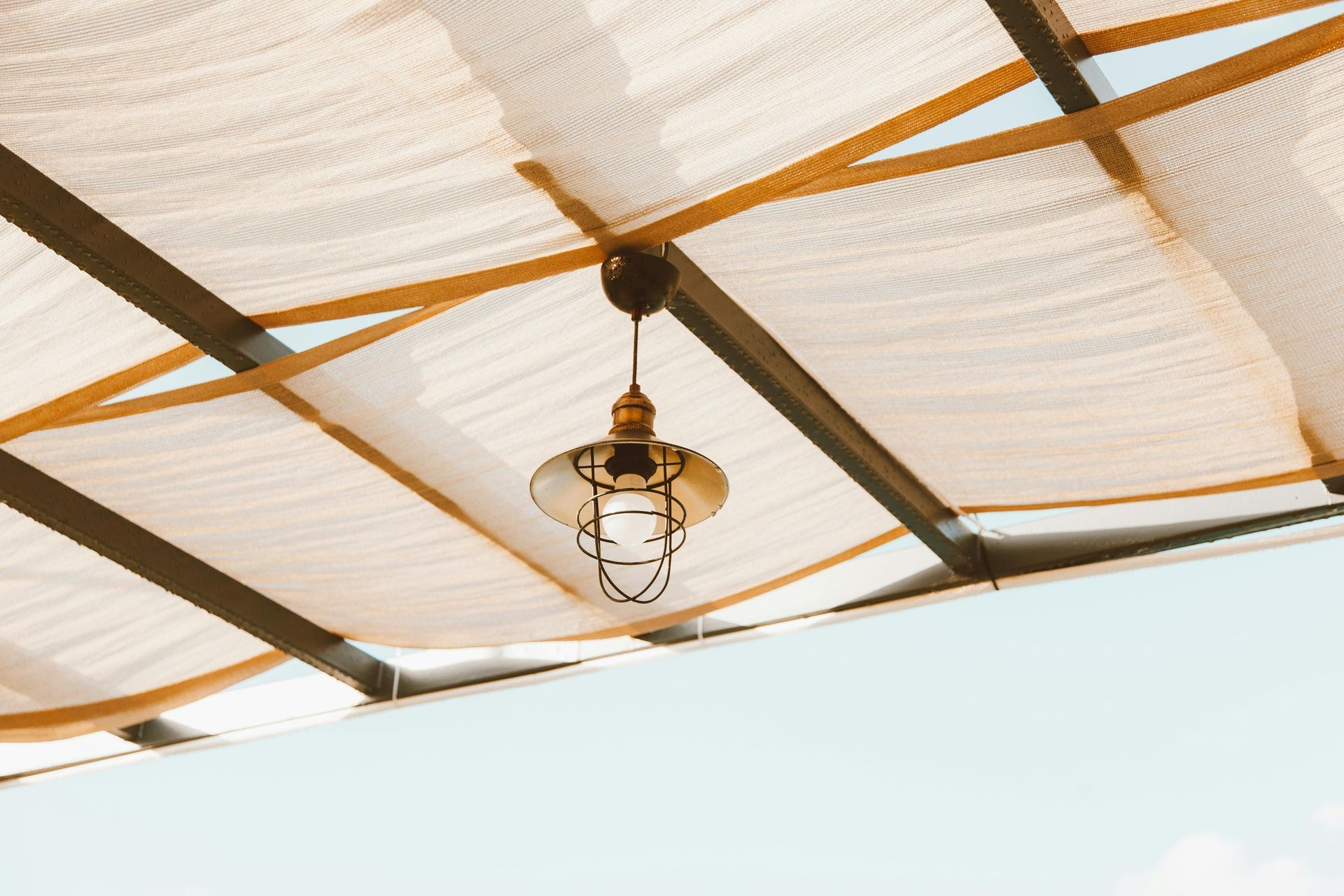 A man is working on the roof of a house.
