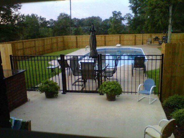 Swimming Pool with Metal Fence — Pascagoula, MS — Gulf Coast Fence Co.