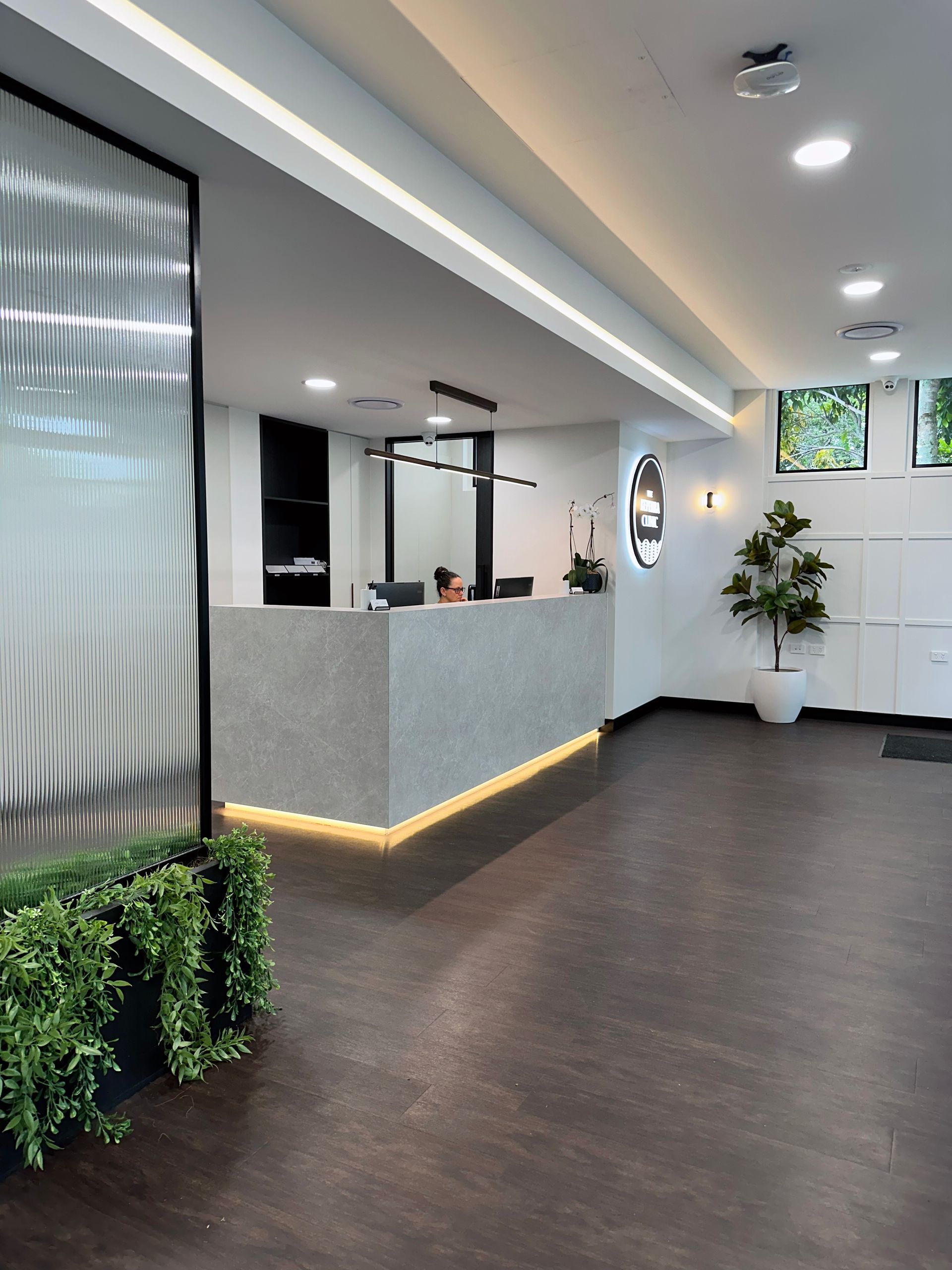 A doctor is holding the hand of a patient.