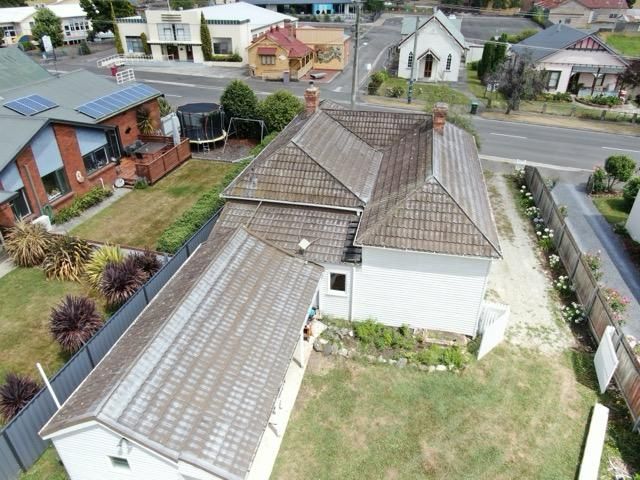 picture of house before roof replacement from back view in launceston