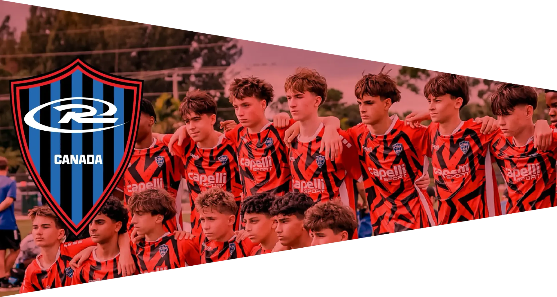 A team of young athletes with medals pose, holding a trophy and banner that reads Champions. Logo is the R2 Midwest.