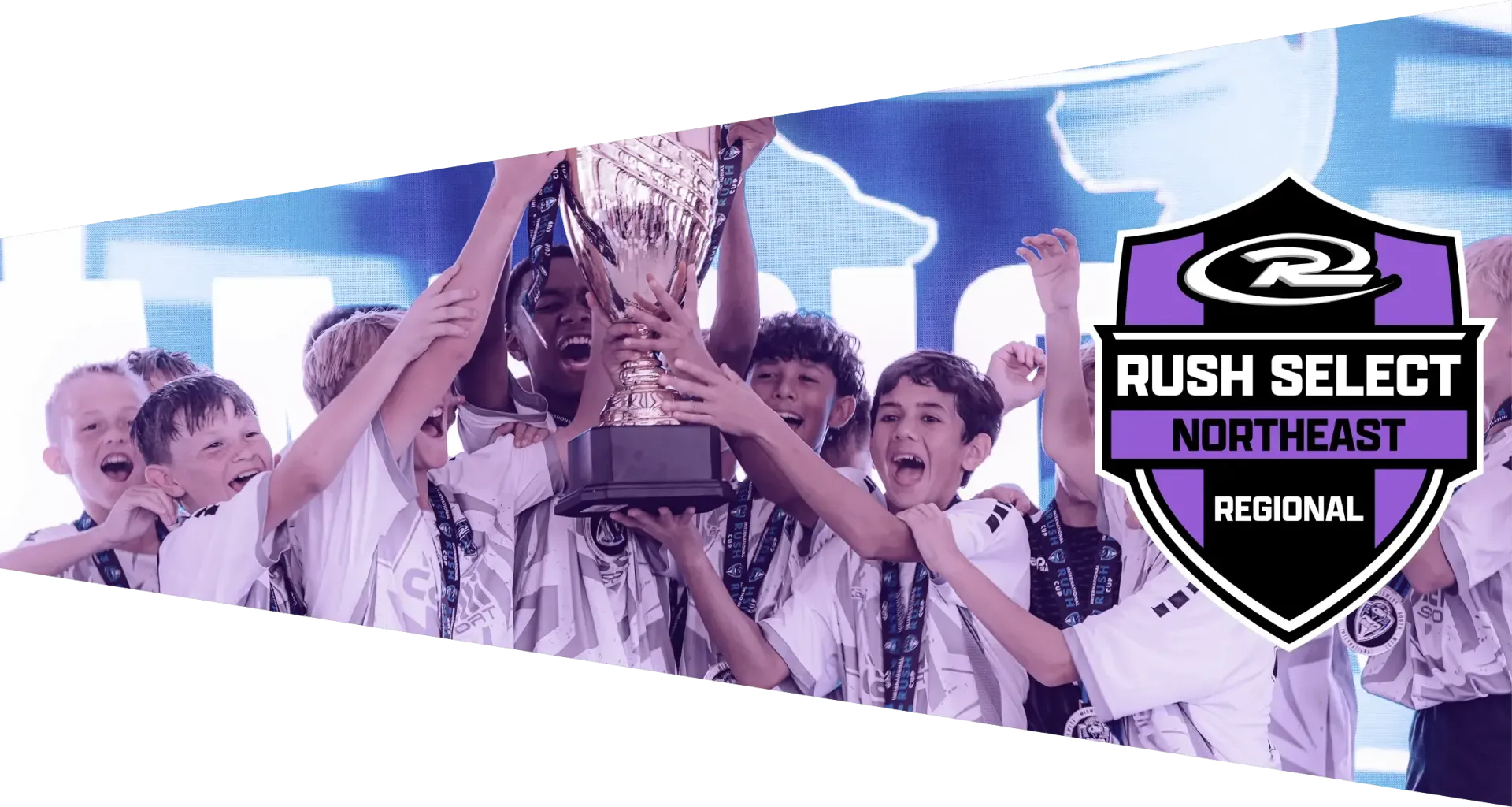 Soccer team celebrates victory on a field, holding a banner; logo in the corner.