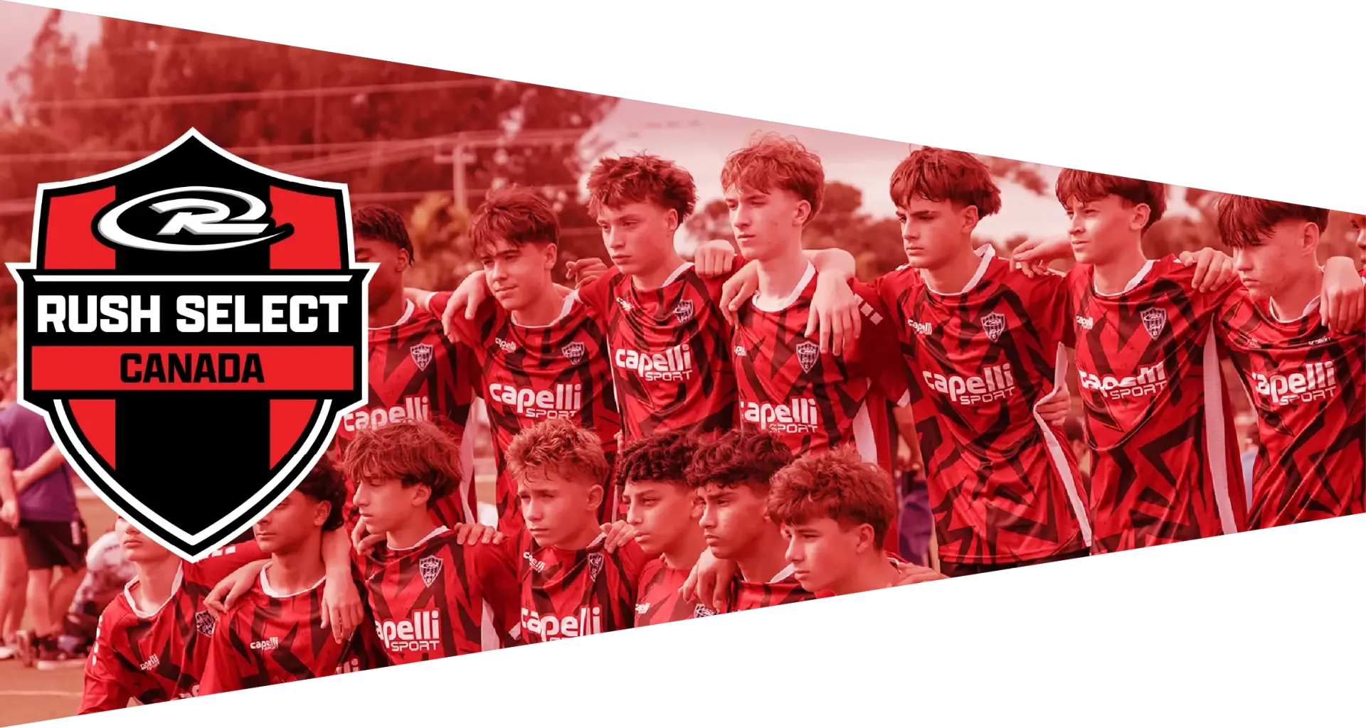 A team of young athletes with medals pose, holding a trophy and banner that reads Champions.  Logo is the R2 Midwest.