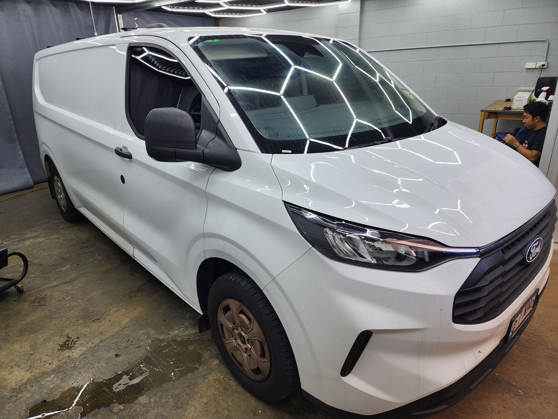 A White Bentley Sedan Parked in a Garage — Superior Window Tinting & Whitewalls in Portsmith, QLD