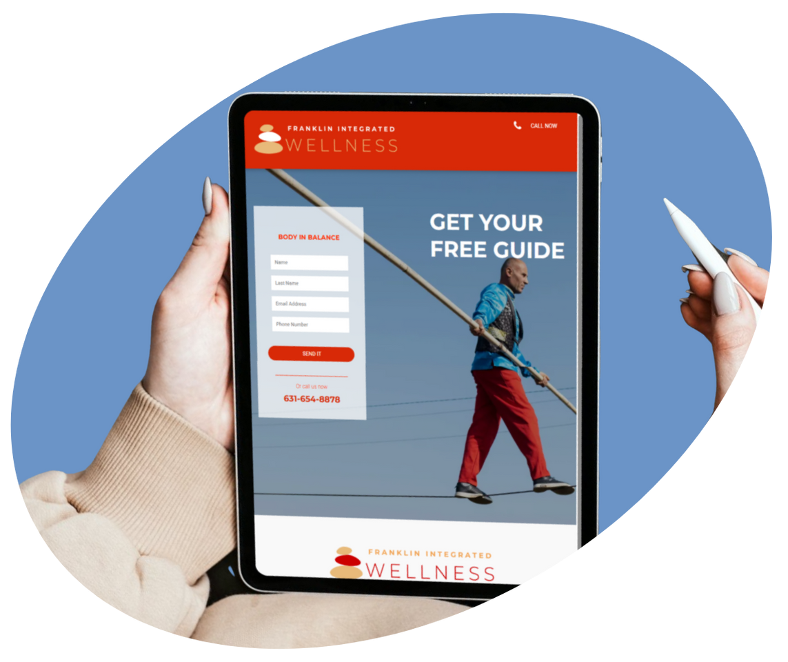 Two people smiling while one holds a smartphone displaying a website with the text 