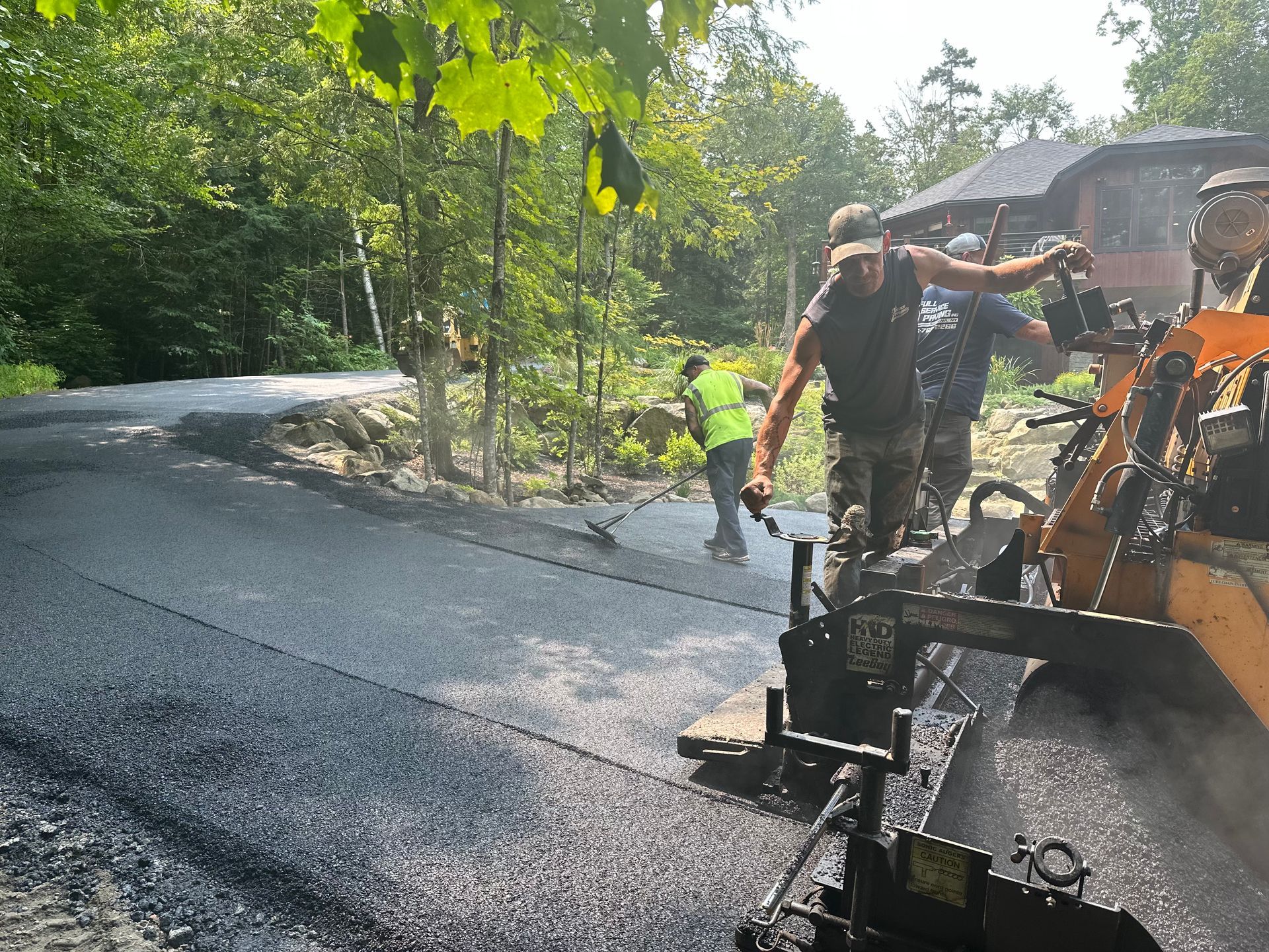 A group of people are working on a road.