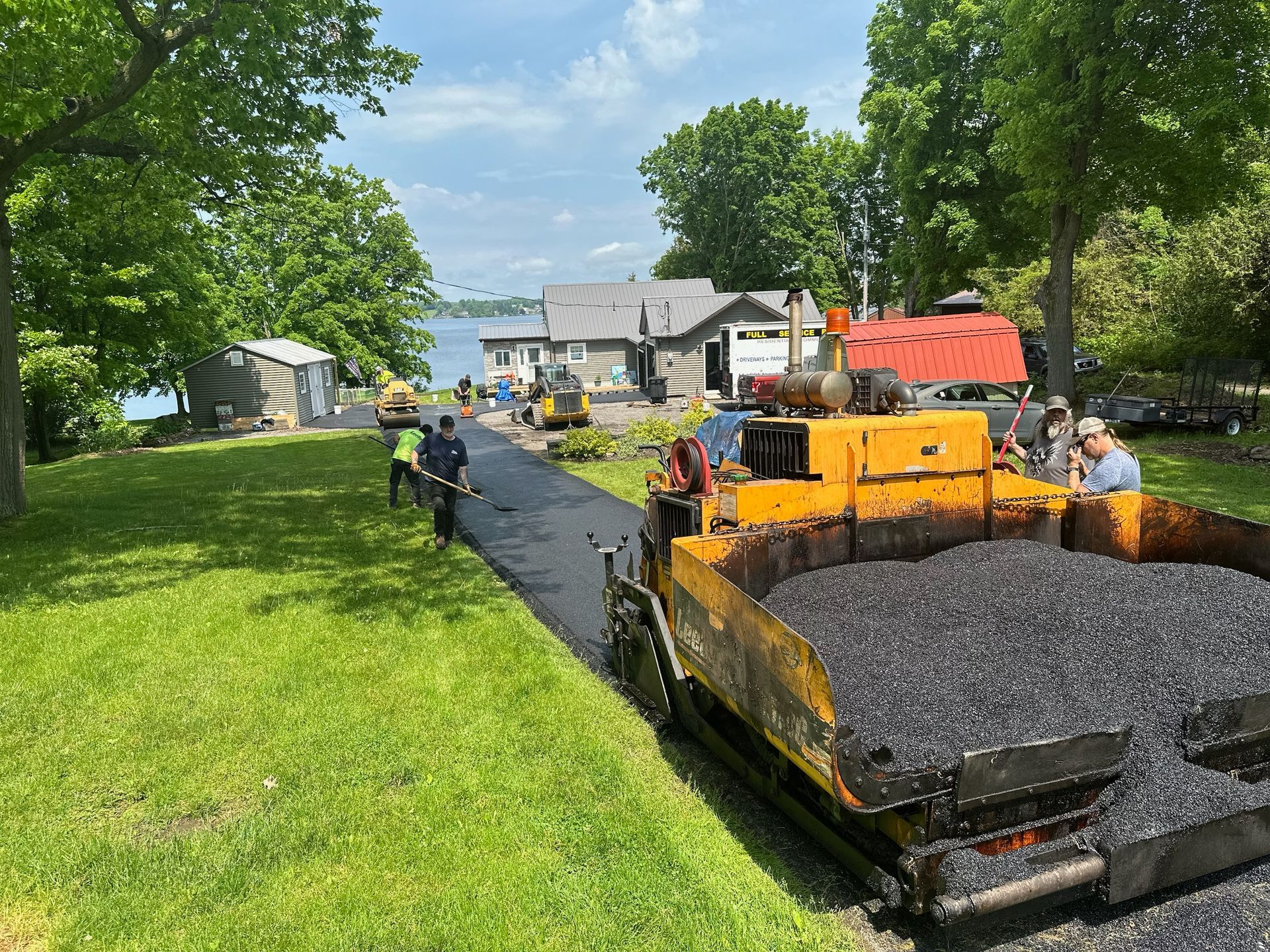 A road is being paved in front of a house.