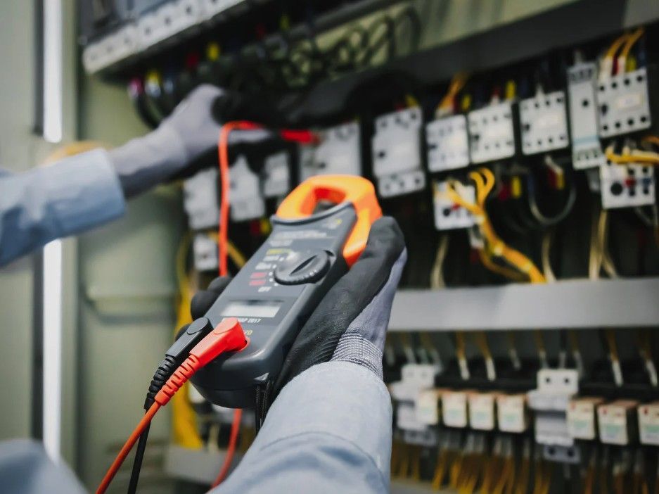 Derbyshire Electrical Specialists inspecting the fuse box for a commercial property in Derby