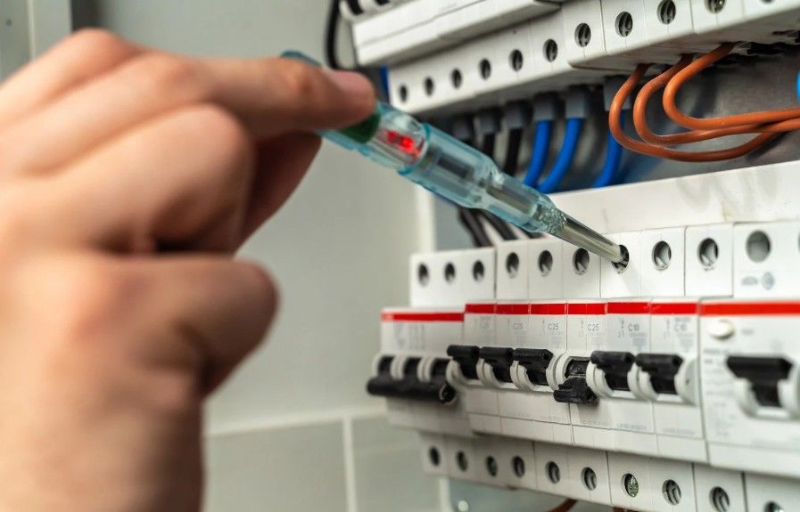 Derbyshire Electrical Specialists checking a circuit breaker in Derby