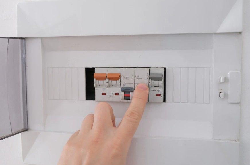 Derbyshire Electrical Specialists checking a trip breaker in Derby