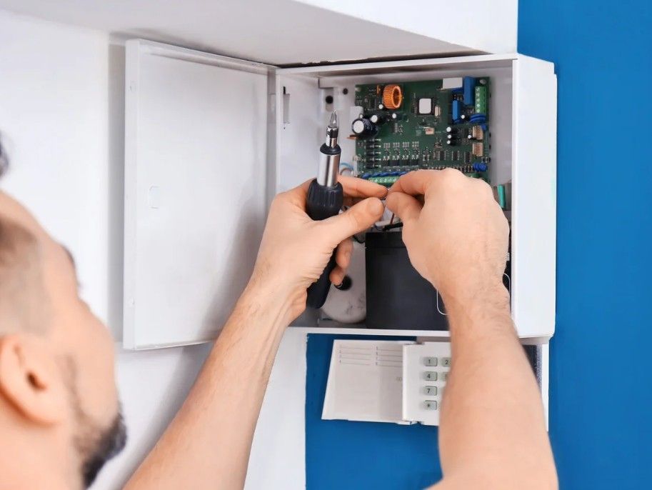 Derbyshire Electrical Specialists testing a burglar alarm  in Derby