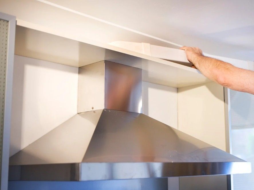 Derbyshire Electrical Specialists fitting a commercial kitchen extractor hood for a restaurant in Derby