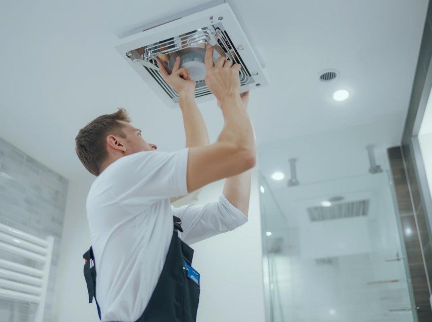 Derbyshire Electrical Specialists fitting a bathroom extractor fan in Derby