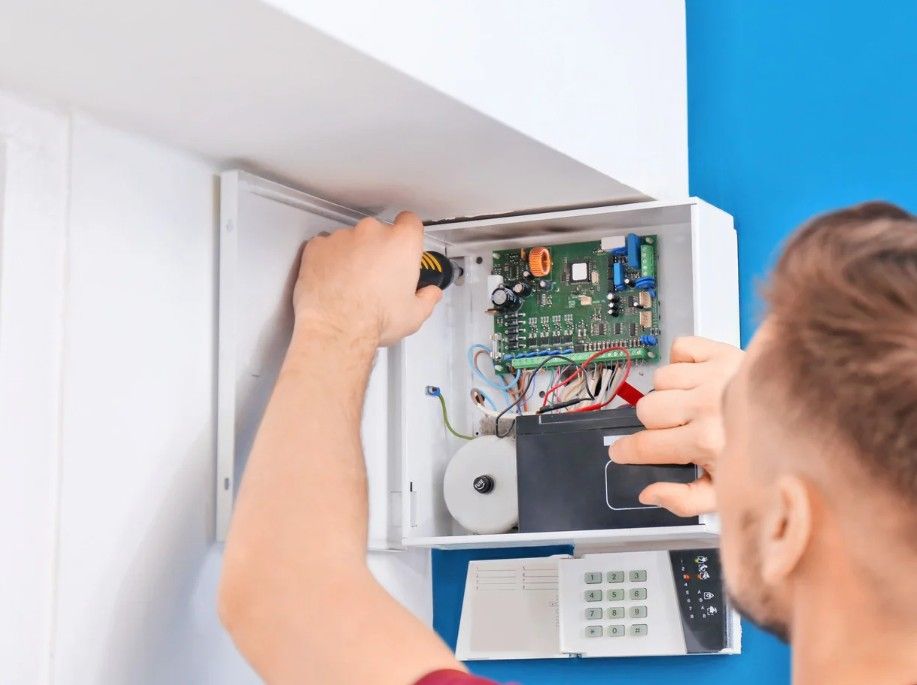 Derbyshire Electrical Specialists installing a house burglar alarm  in Derby