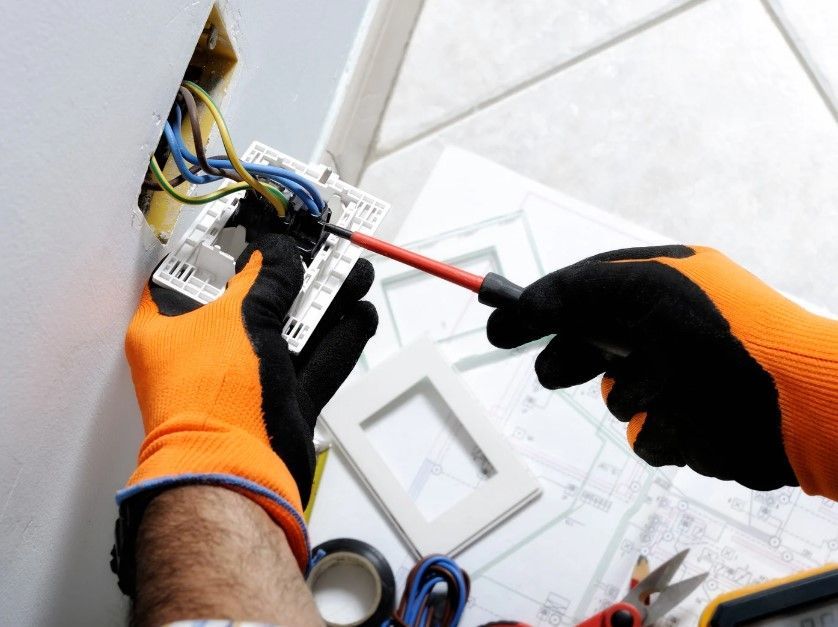 Derbyshire Electrical Specialists fitting a new socket in a property in Derby