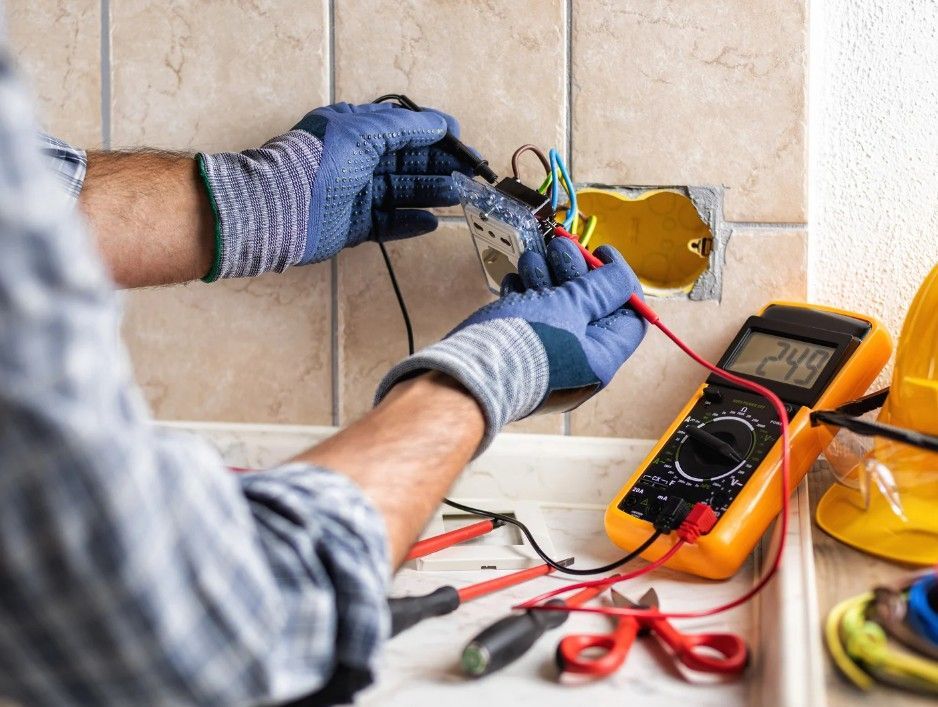 Derbyshire Electrical Specialists inspecting a kitchen socket in Derby