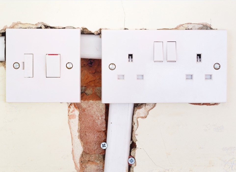 Derbyshire Electrical Specialists rewiring some sockets at a house in Derby