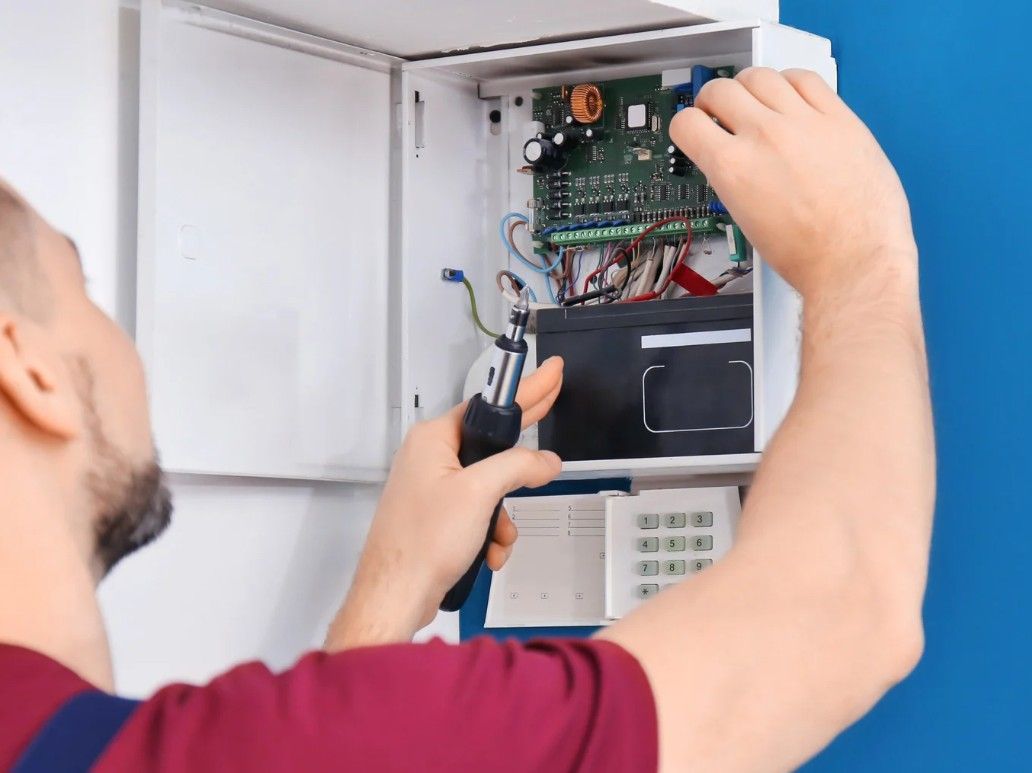 Derbyshire Electrical Specialists installing a home alarm system in Derby