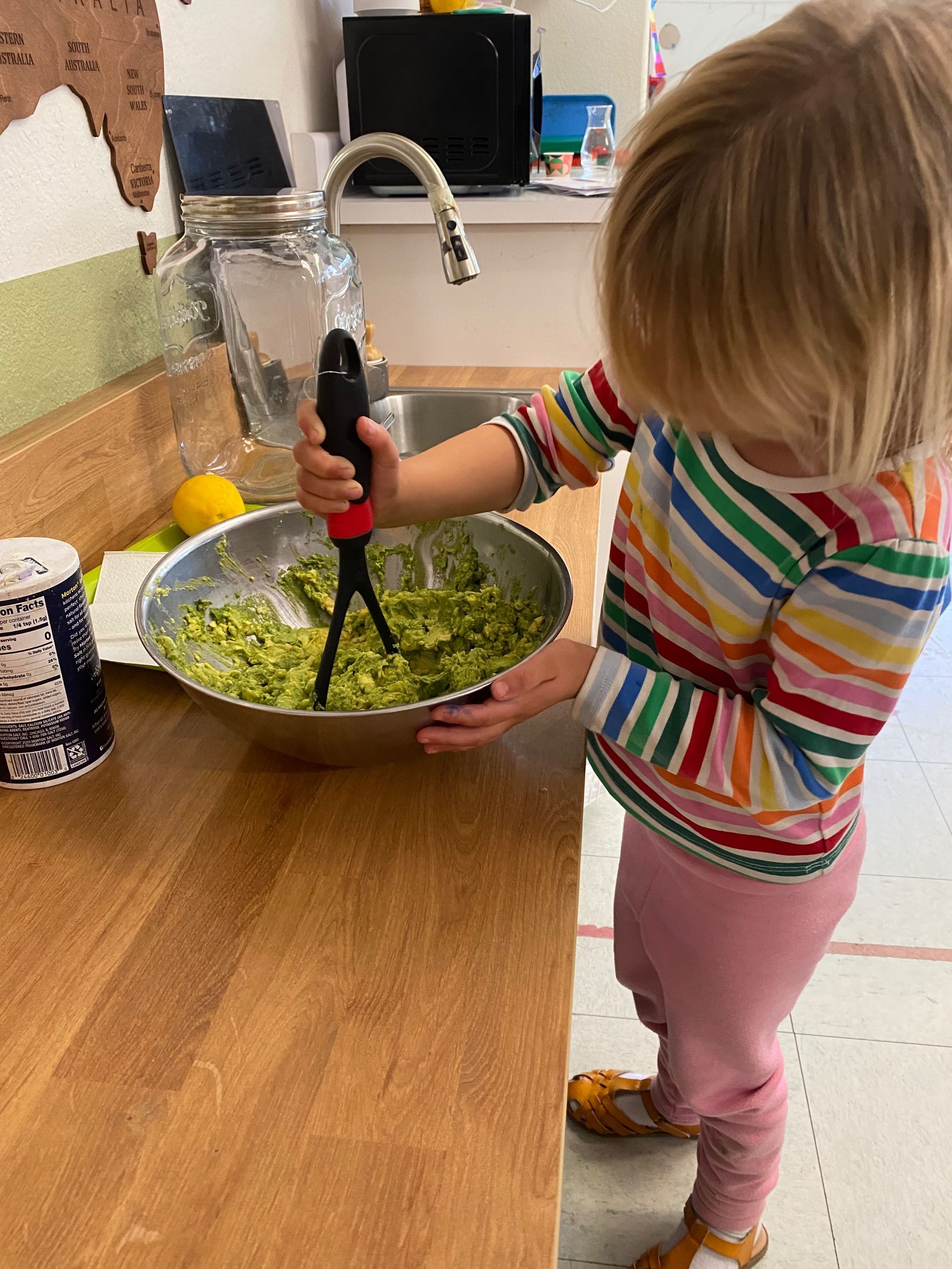 montessori child working with practical life activity