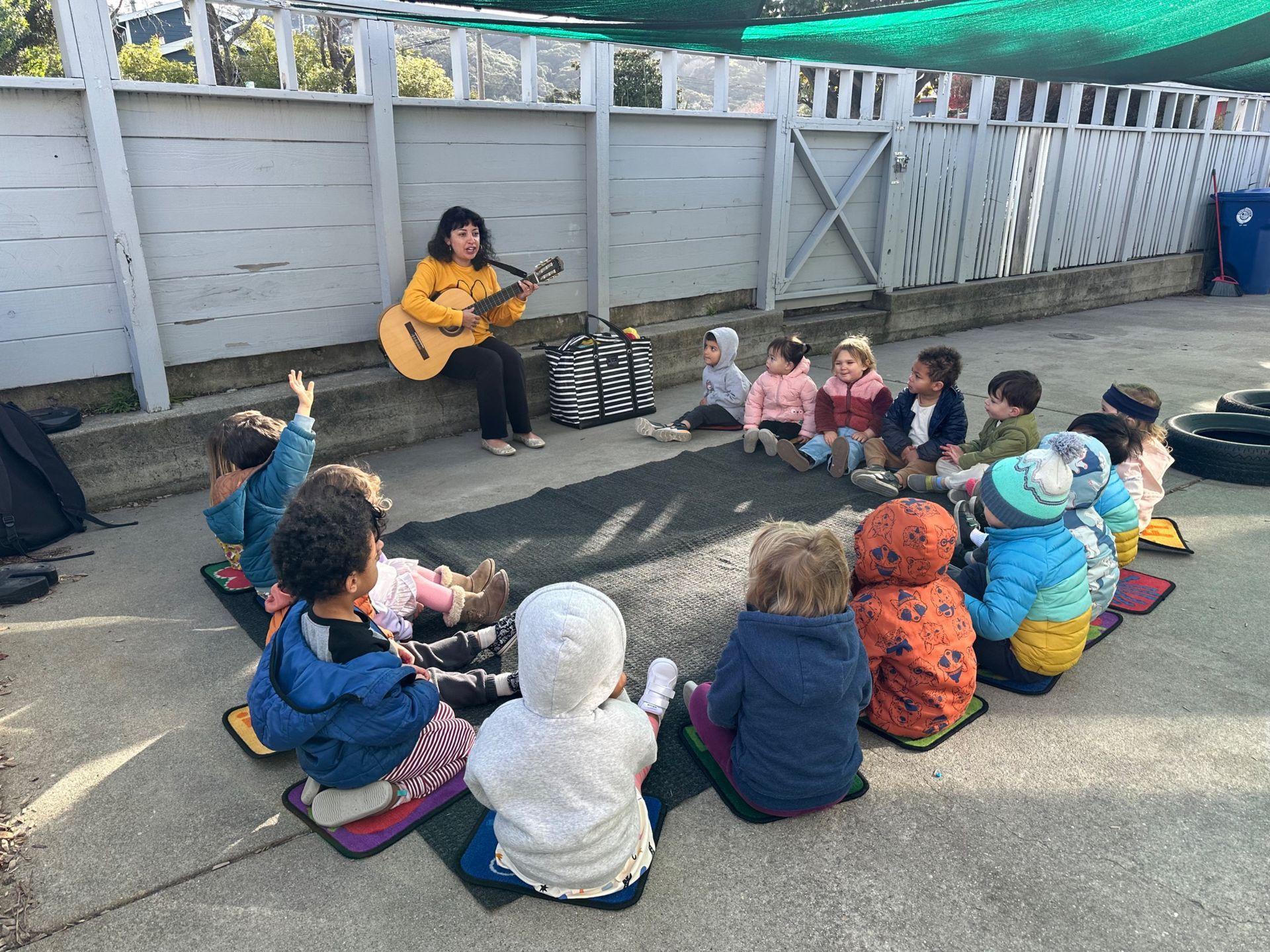 montessori child with music teacher guide outside the classroom