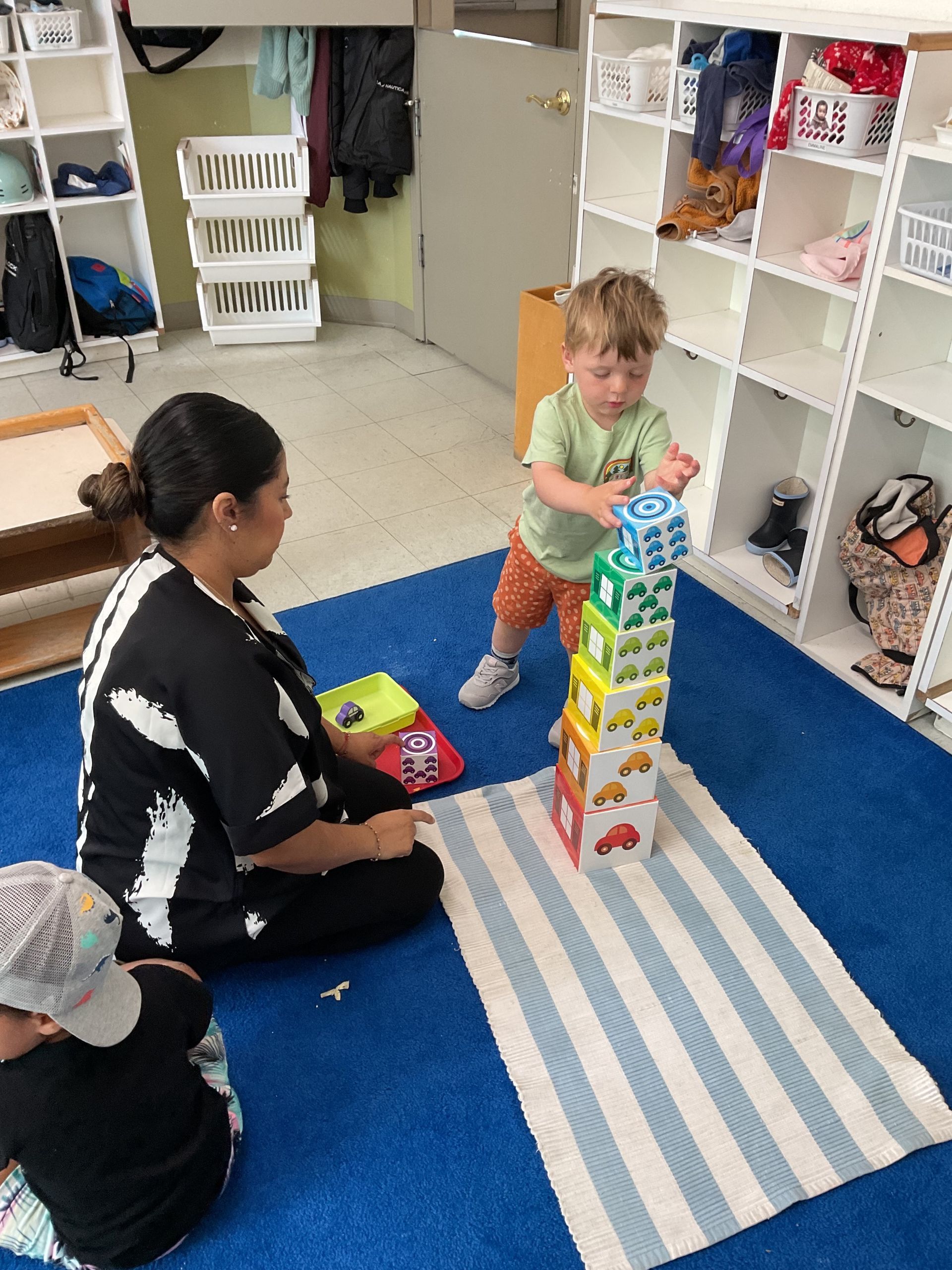 montessori toddler working with block stacking