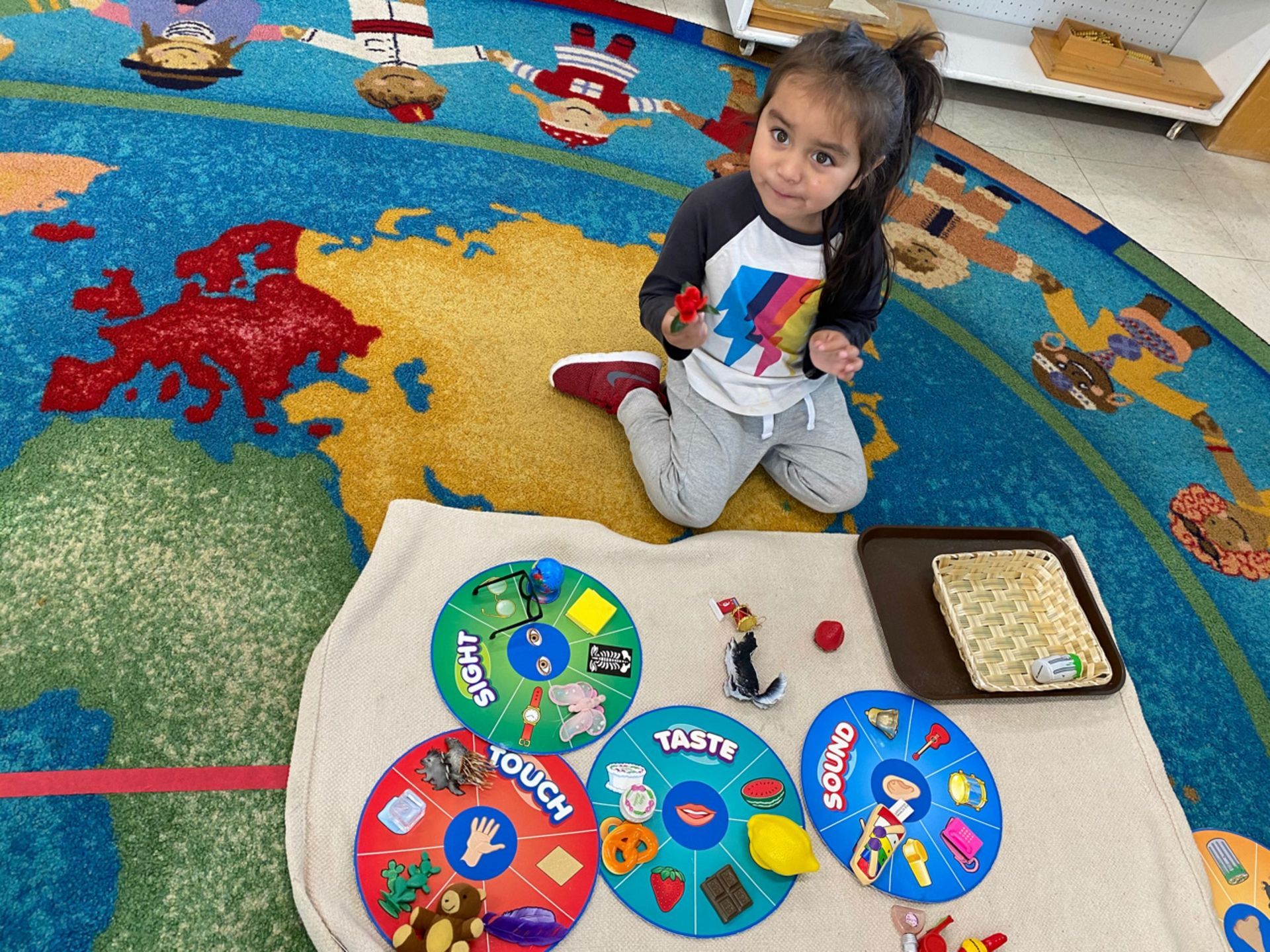 montessori child working with 5 senses activity