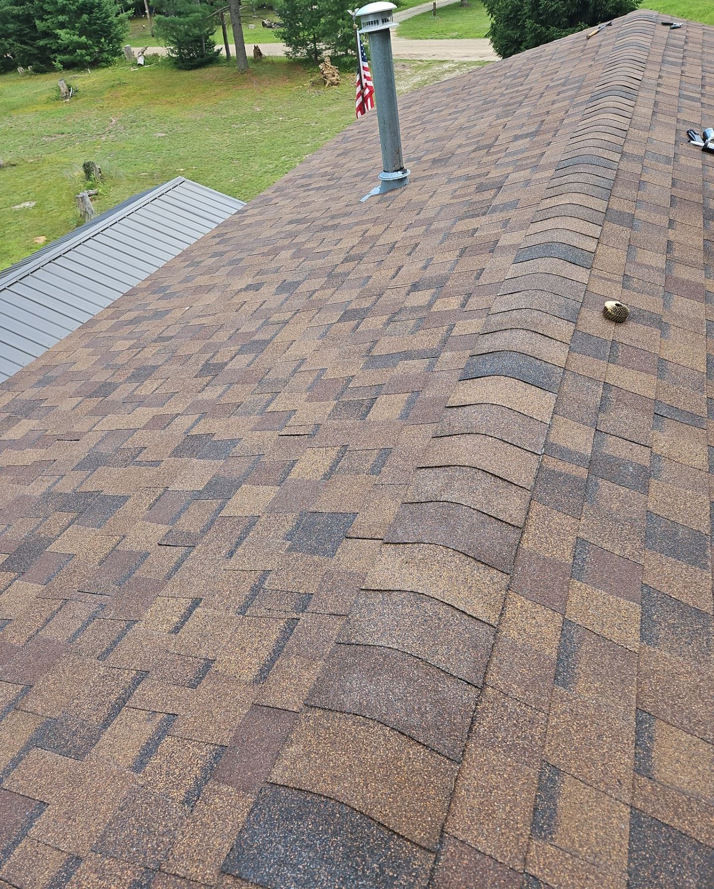 Prescott, Michigan roofing project featuring Atlas shingles, installed by Northern Michigan roofing experts.