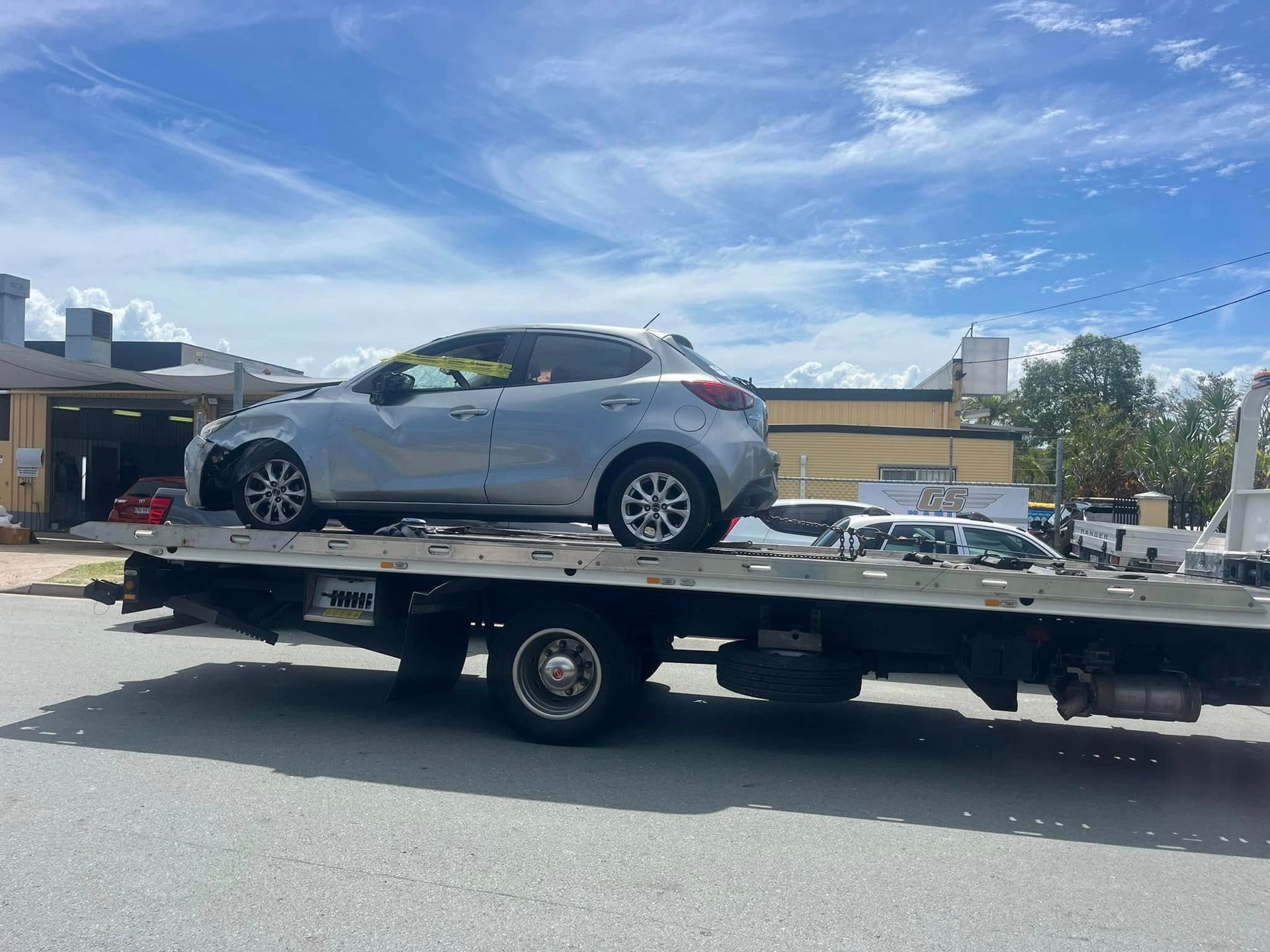Silver Car on a Flatbed Tow Truck — A B & Forge Towing In North Lakes, QLD